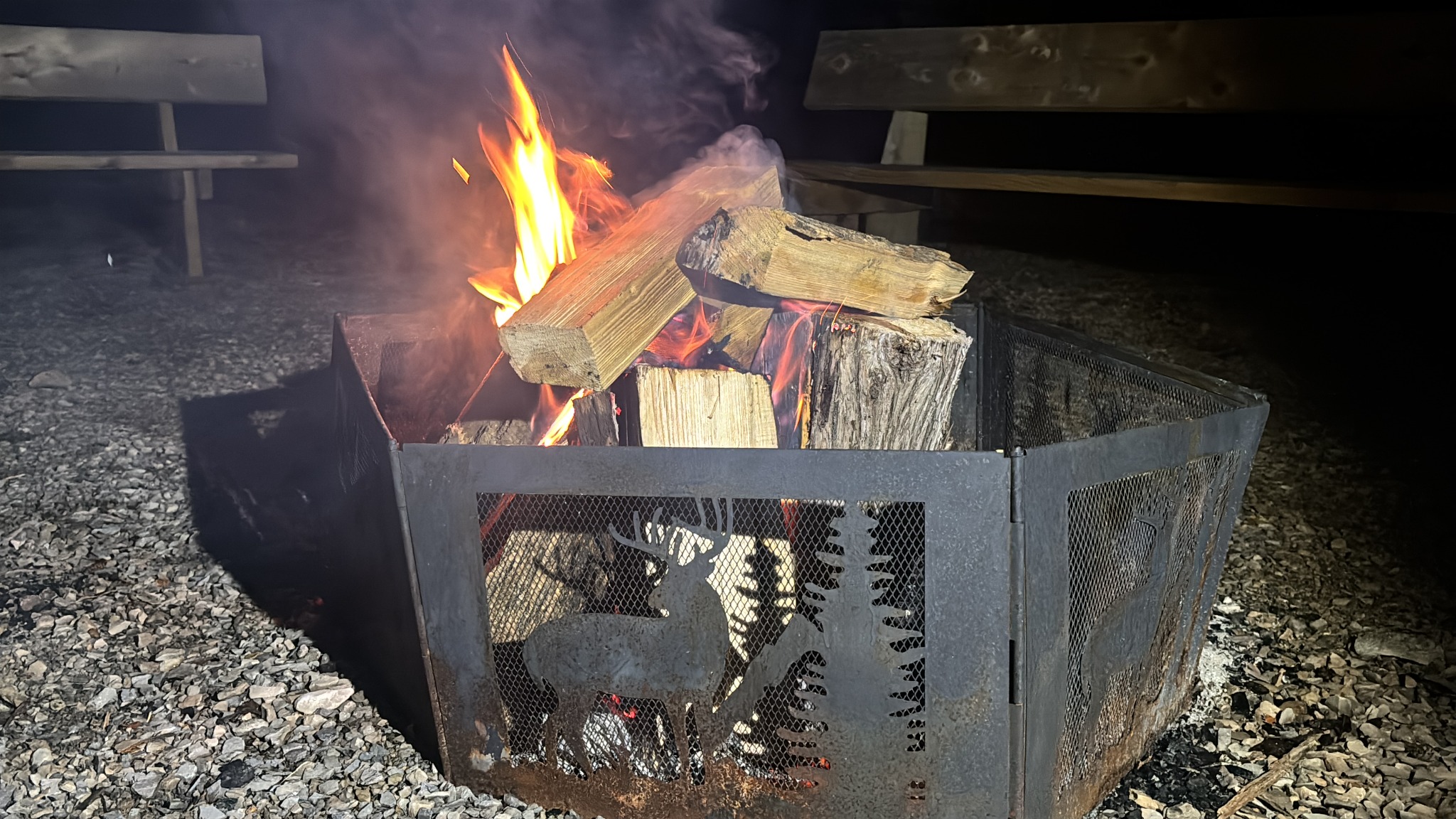 A fire burning in the cottage's custom firepit